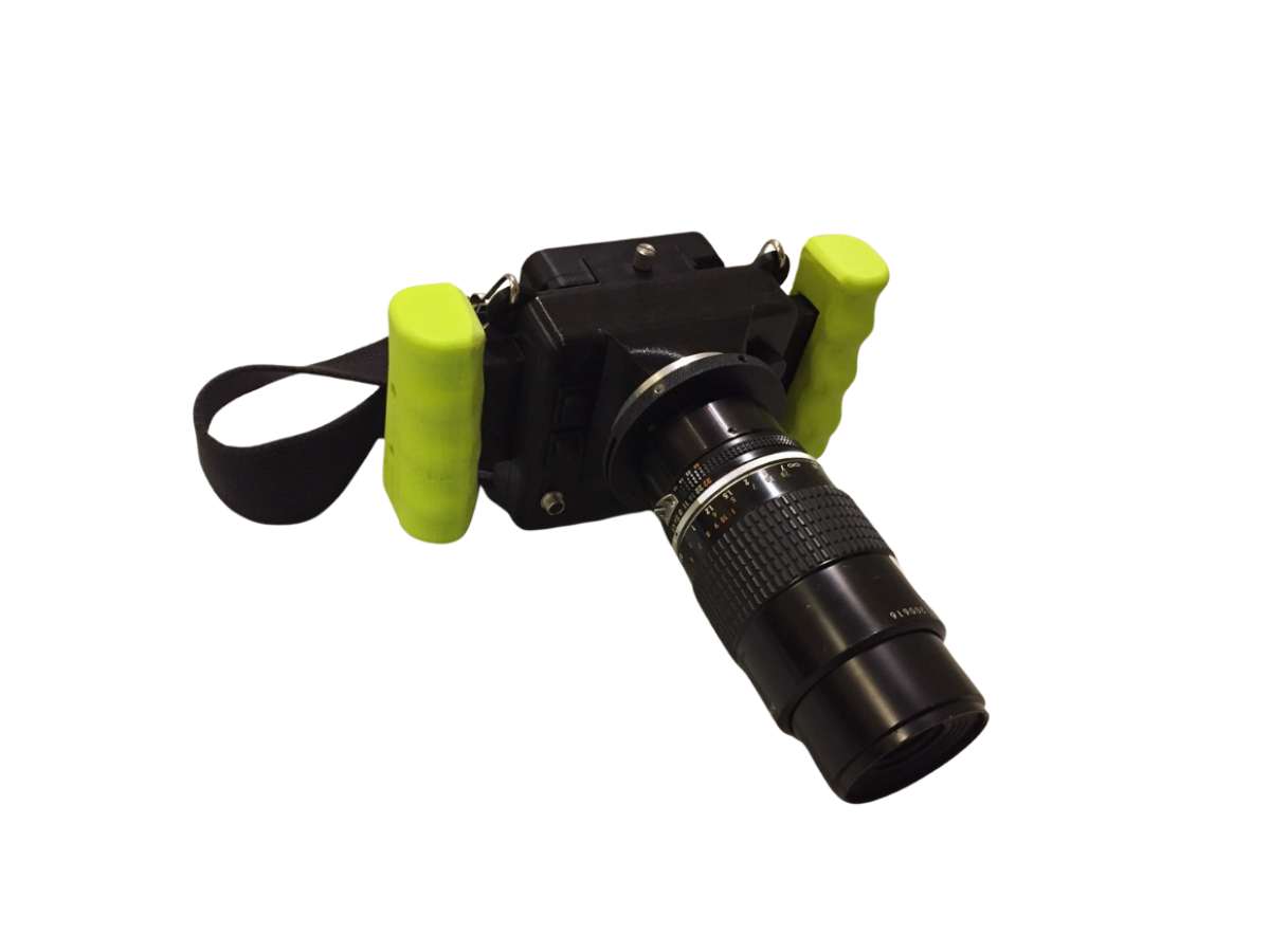 CRIS II body with mounted nikon lens and neckstrap