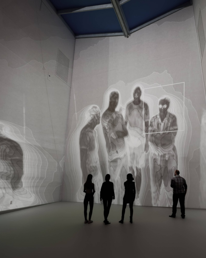 Image of spectral subjects installation with viewers standing in front